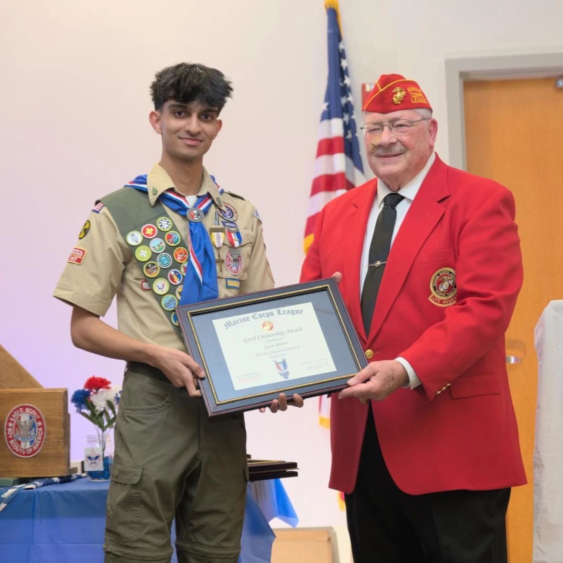Jason in his Eagle Scout uniform receiving a Marine Corps League Good Citizenship Award.